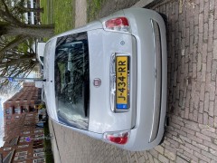 Fiat 500 1 2 uit 2010 met panoramadak en zomer winterbanden