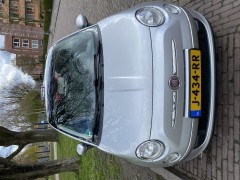 Fiat 500 1 2 uit 2010 met panoramadak en zomer winterbanden