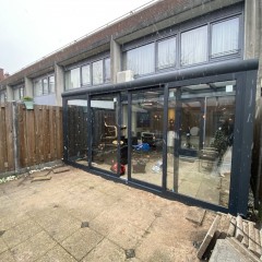 Tuinkamers overkapping carport glazen schuifenwanden zonwering schuifp