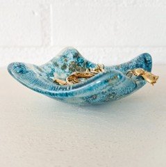 Een vide-poche  een glazen sierraden schaaltje